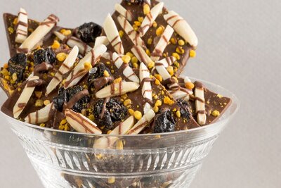 Milk Chocolate Bark with Bee Pollen, Toasted Slivered Almonds, Dried Blueberries, Black Lava Sal